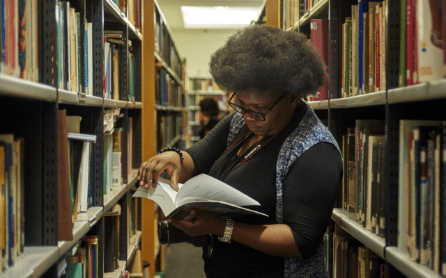 ITP participant reads a book in the British Museum's Anthropology Library.