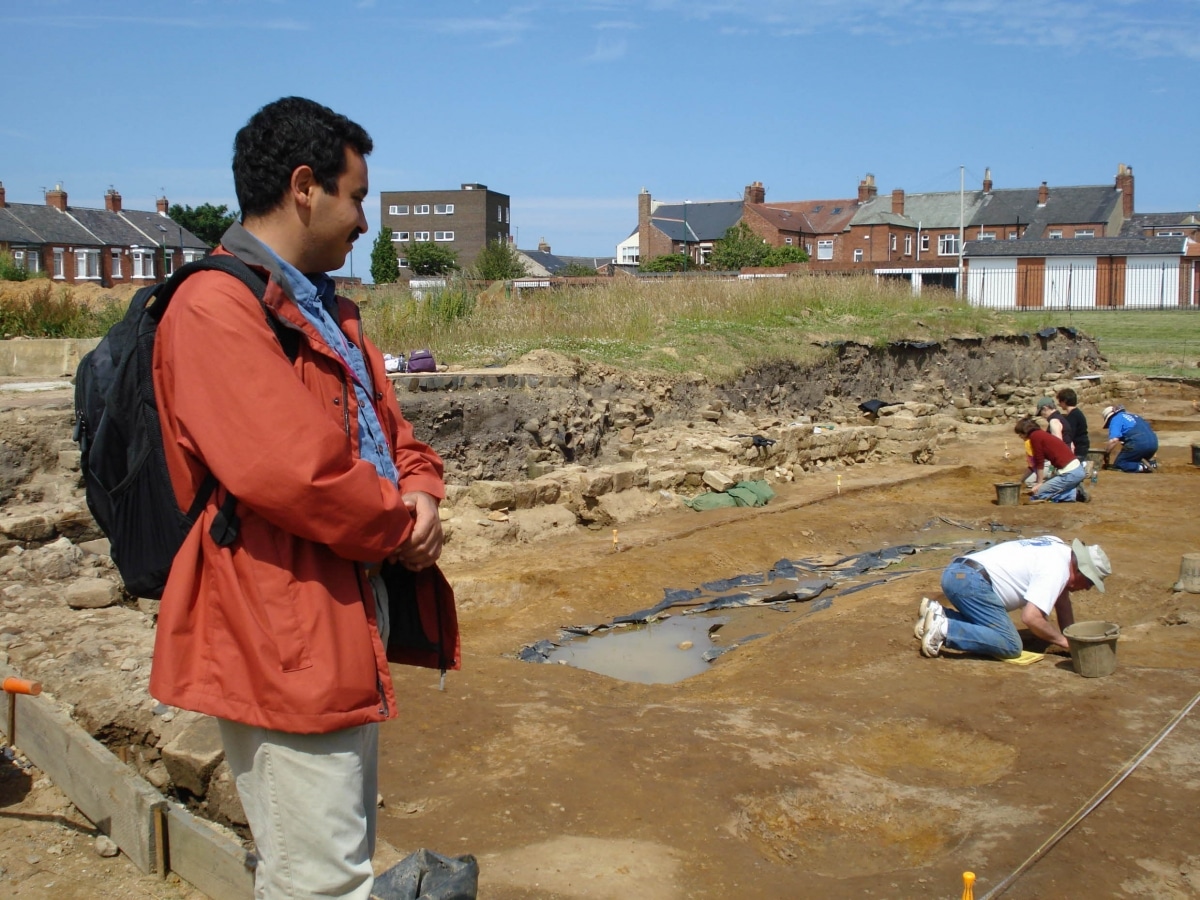 A person observing an excavation site in Newcastle