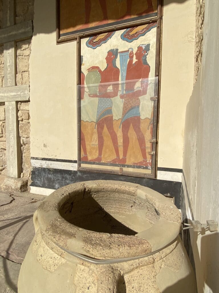 Large pot and wall painting at archaeological site of Knossos. 