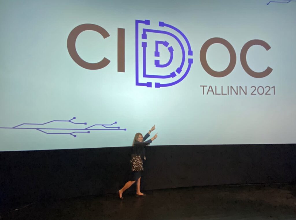 Rema Zeynalova pointing to a sign at the CIDOC conference