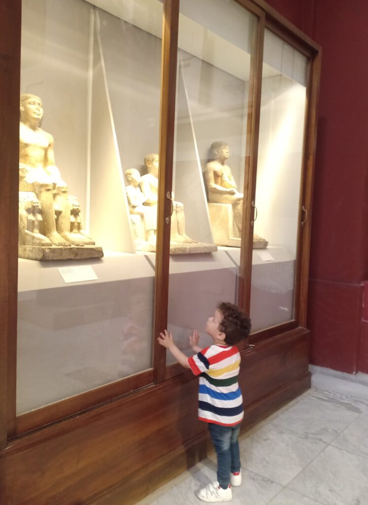 Child looking at a display at the Egyptian Museum