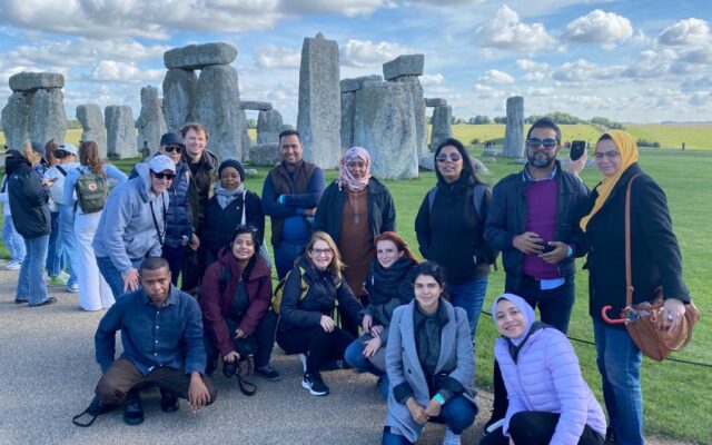 ITP 2022 fellows take a group photo in front of Stonehenge