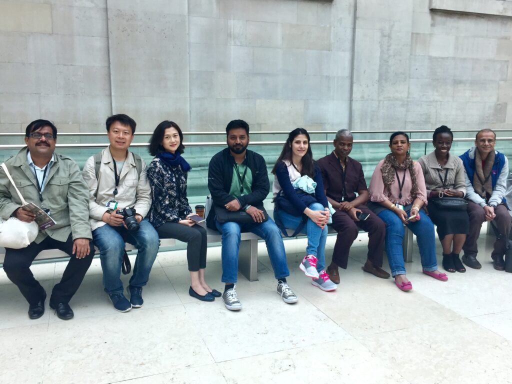 Mahesh sits on the far left on a bench of ITP colleagues in the British Museum Great Court