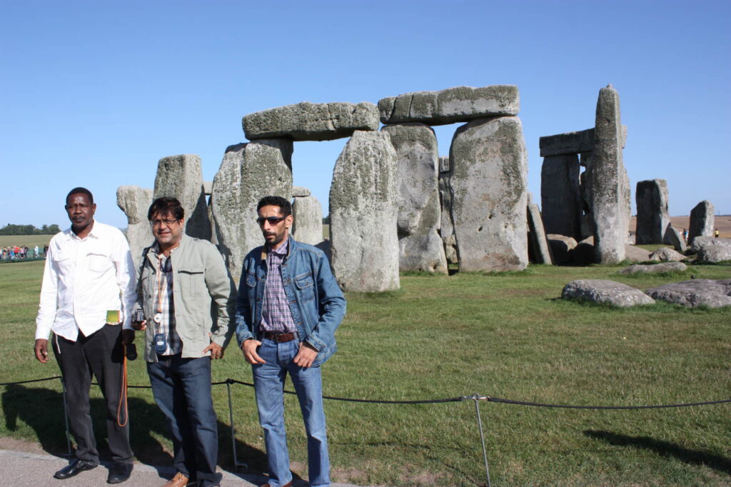 Mahesh Kalra and ITP colleagues stand in front of Stonehenge