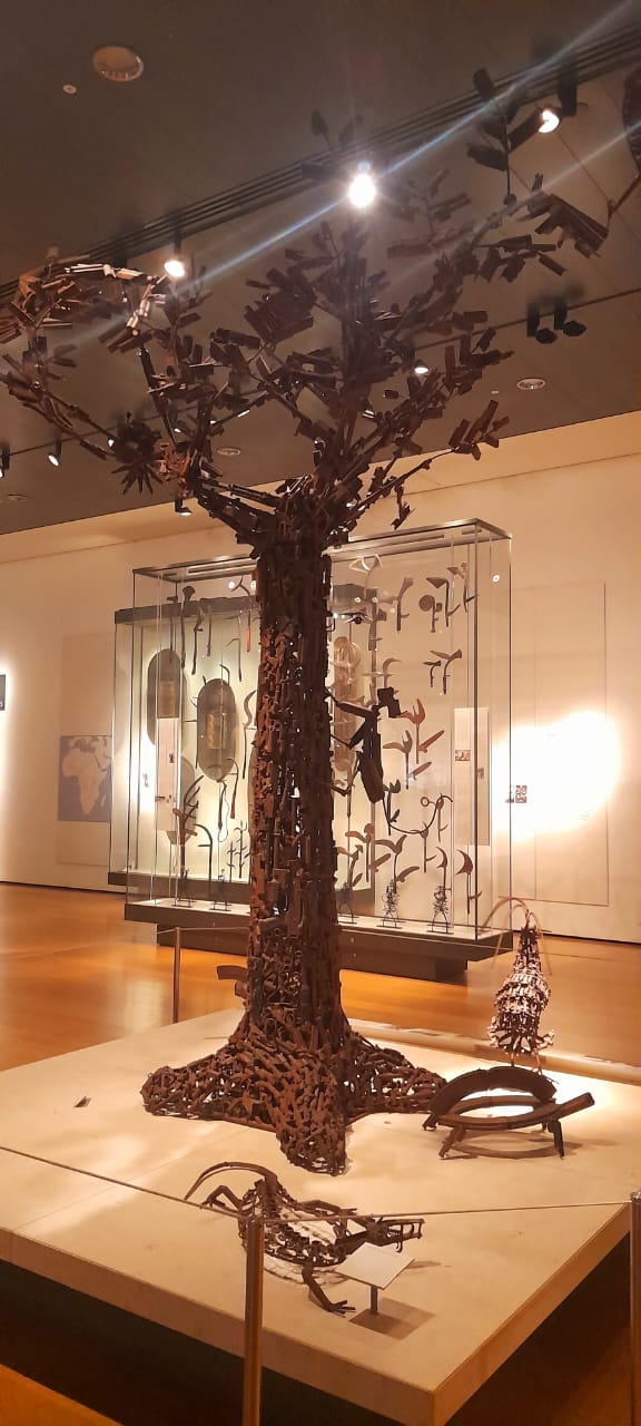 The Tree of Life artwork - a sculpture of a tree made out of guns,