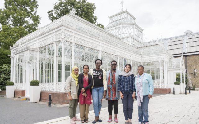 6 ITP fellows stand outside the greenhouse at Horniman Museum