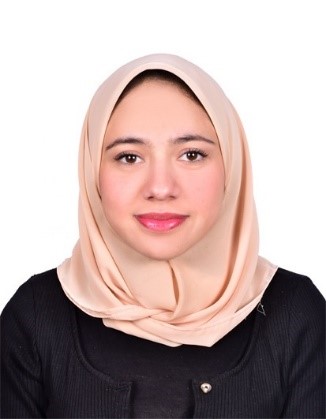 Dana Khalil, wearing a peach coloured headscarf and black top