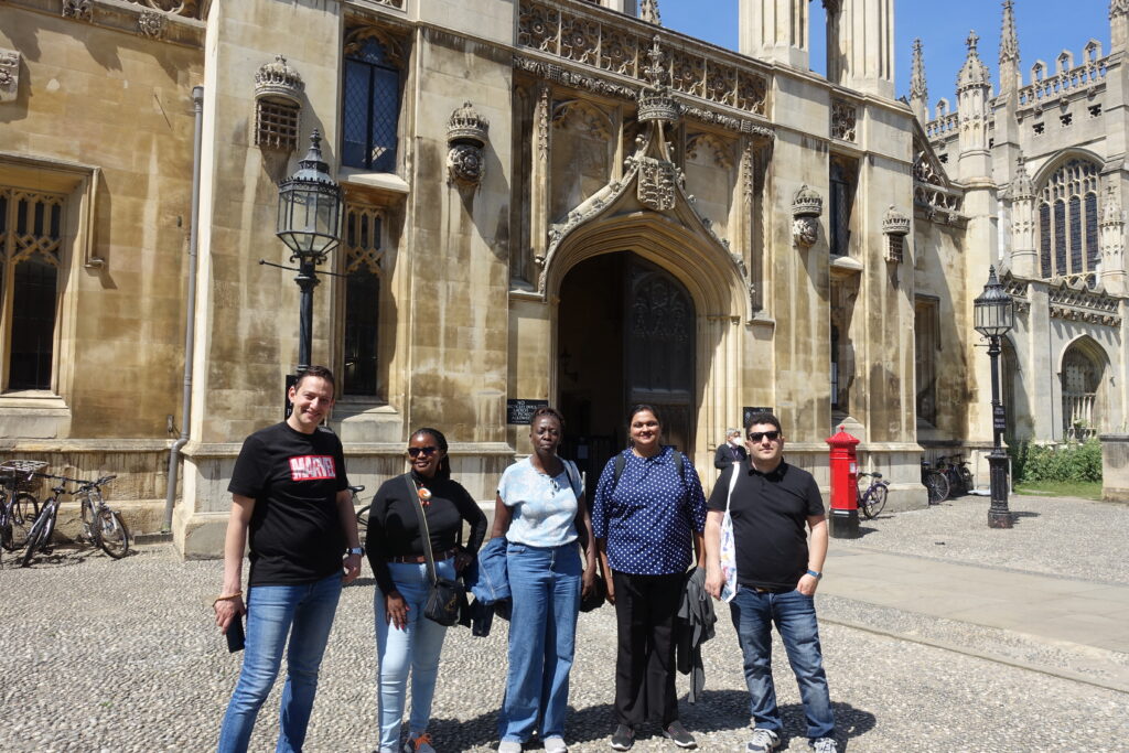 ITP fellows standing outside Kings College Cambridge