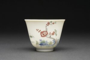 Chinese porcelain wine cup with flowers painted onto its sides