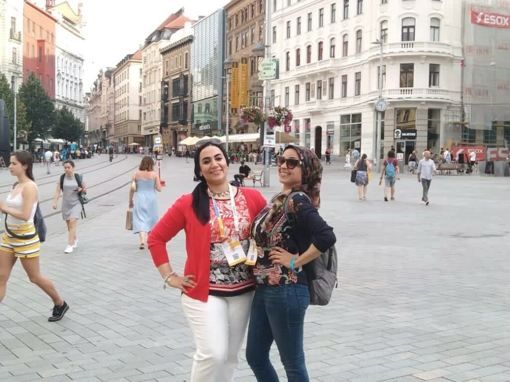 Noor in a town square with ITP colleague Nevine Nizar