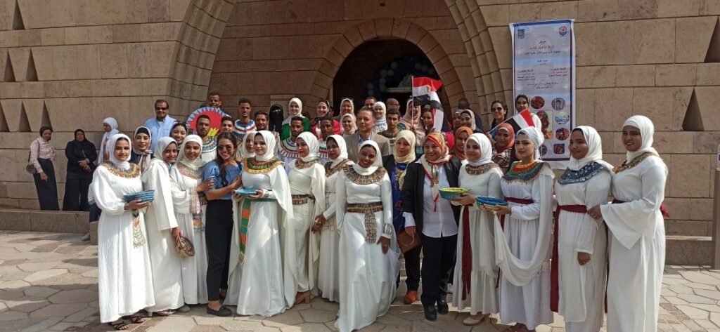 Group of people outside the Nubia museum dressed in pharaonic costume