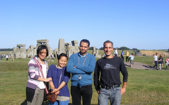 Mohamed Ahmed standing in front of Stonehenge with three ITP colleagues.