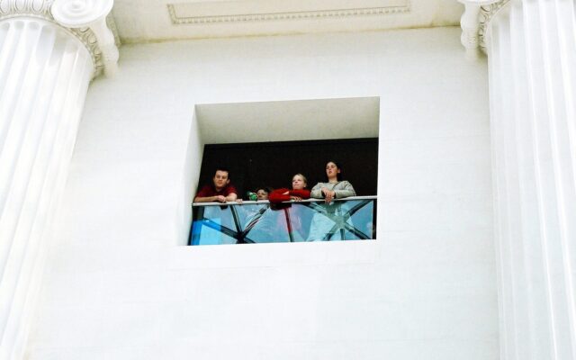 Photograph of 4 people overlooking the Great Court at the British Museum.