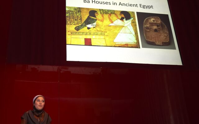 Photograph of Marwa delivering a speech on Ba houses in Ancient Egypt.