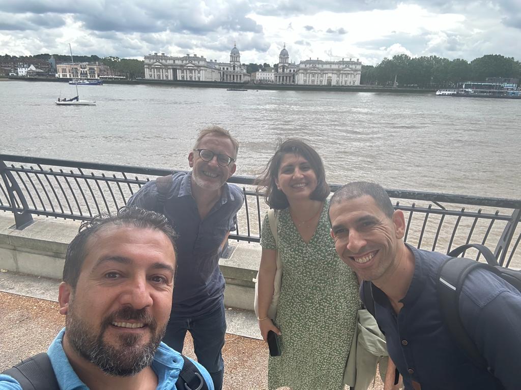 ITP fellows Ali Demirkiran, Elif Büyükgençoğlu, and Aymen Chihaoui with A.G. Leventis Curator of Ancient Cyprus, Greece, and Rome, Thomas Kiely in front of the River Thames