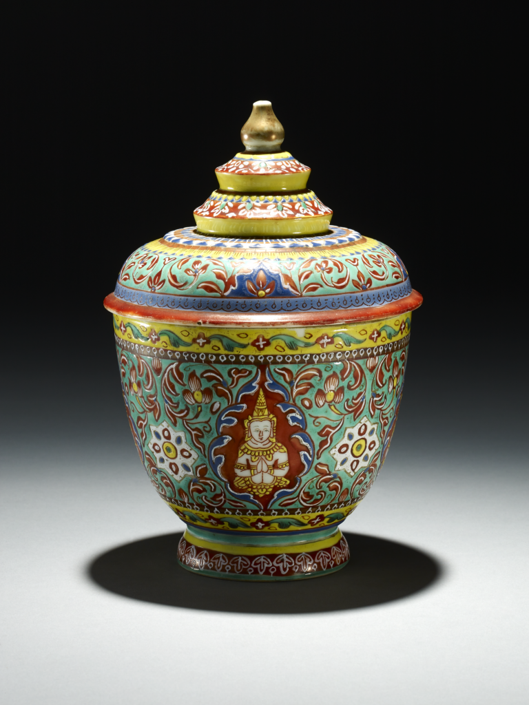 Bowl with cover. Made for the Thai market, decorated with Buddhist figures and flowers. Made of enamelled porcelain.