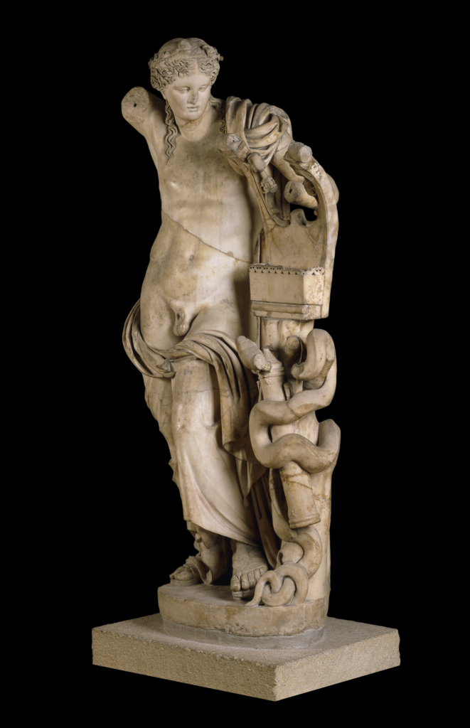 Marble statue of Apollo with a kithara and quiver. He is naked apart from the himation or cloak around his hips. The right arm, which was originally raised, and the left wrist and hand are missing.