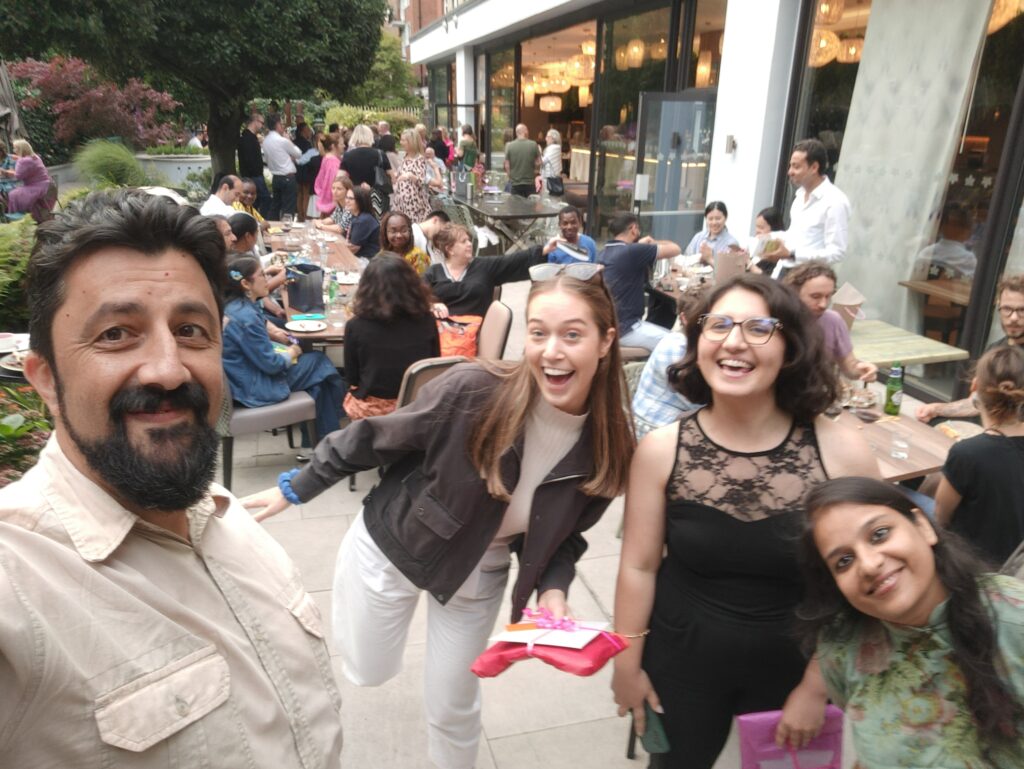 Ciprian taking a selfie with ITP Assistant Amelia Kedge, Elif Buyukencoglu, and Rucha Vibhute at the ITP farewell BBQ.