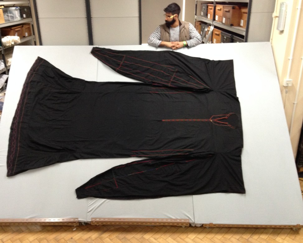 OmarJoseph standing next to a large black textile