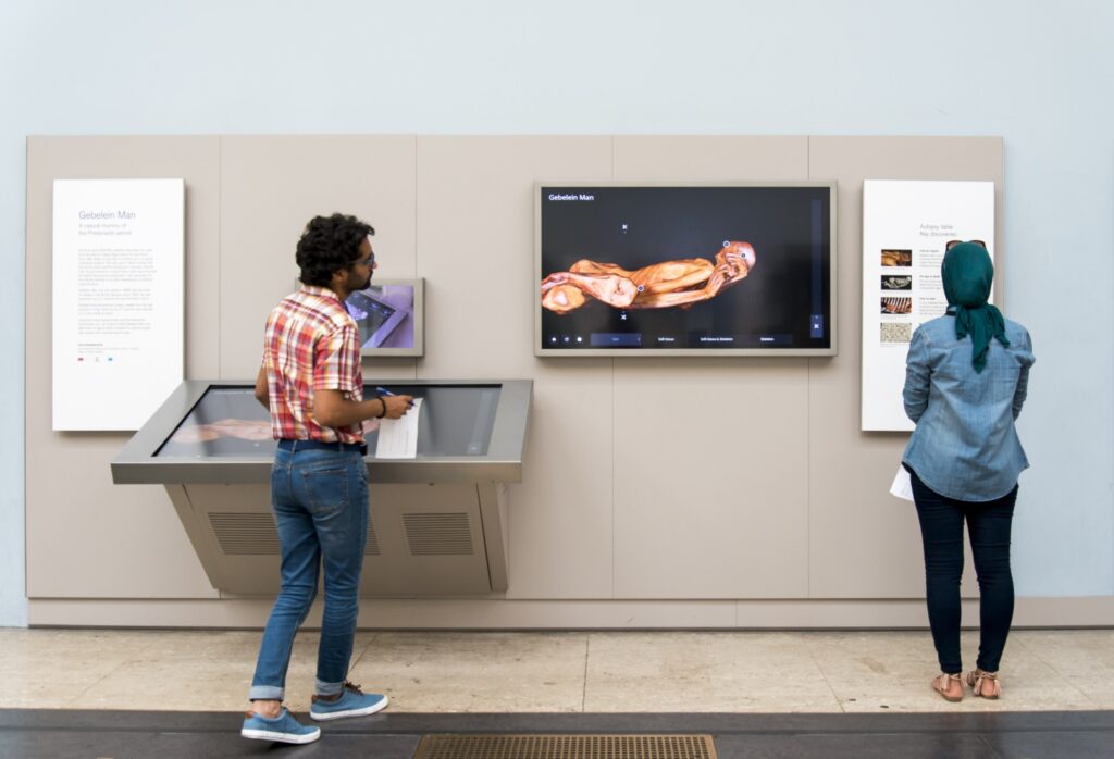 2018 ITP fellows interacting with the digital displays at the British Museum