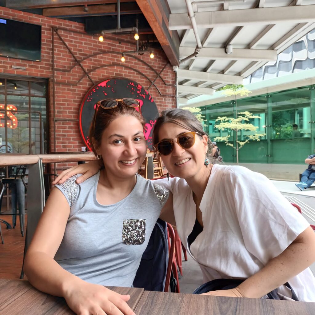 Rema (L) pictured next to Mariana Sainz (R).