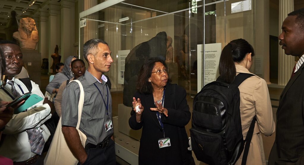 Kusuma speaking to ITP fellows in the galleries at the British Museum.