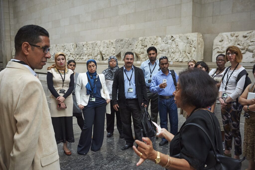 Kusuma speaking to ITP fellows in the galleries at the British Museum.