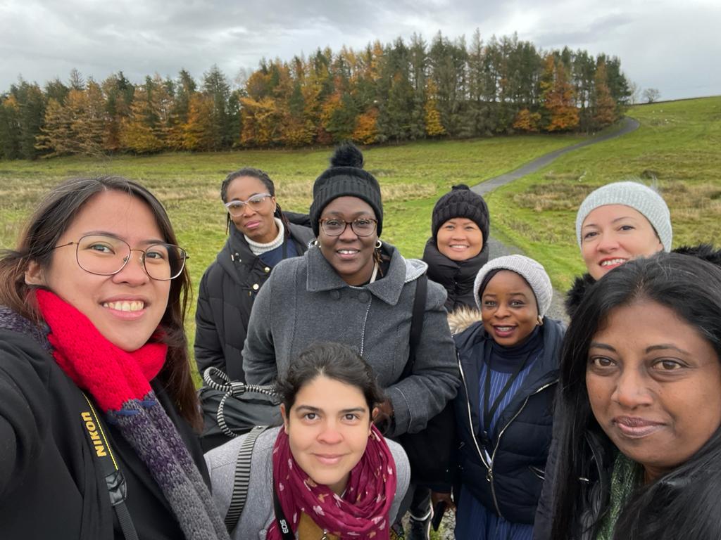 Yanoa taking a selfie with  other ITP fellows at Hadrian's Wall.