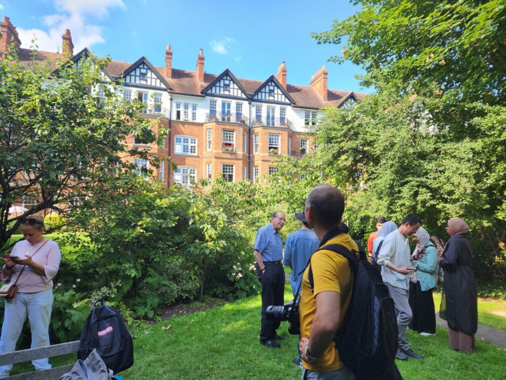 Photograph of people in a garden