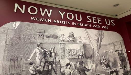 Photograph of exhibition signage reading, "Now you see us: women artists in Britain 1520-1920".  