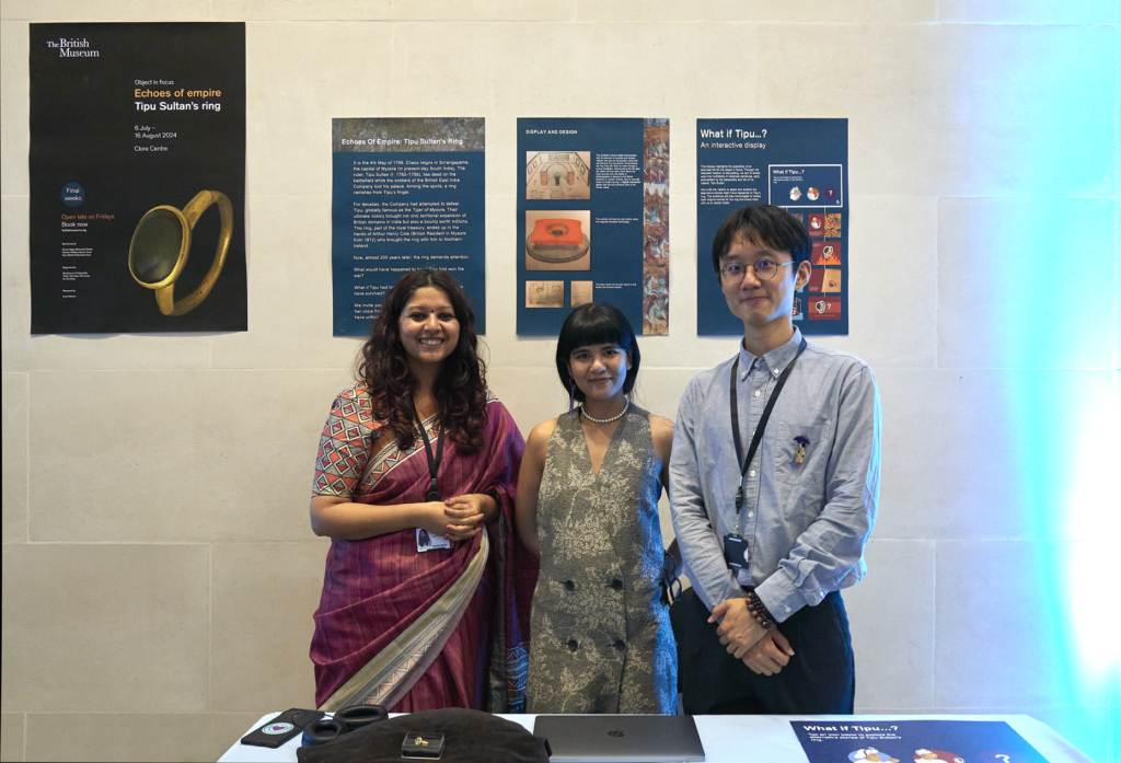 Shubhasree, Pinky and Zecheng stand with their object in focus display