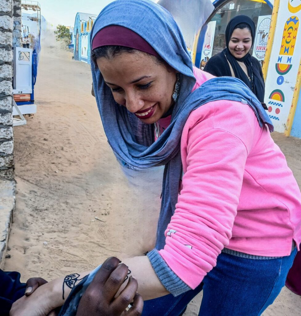Photograph of a woman having a henna painting