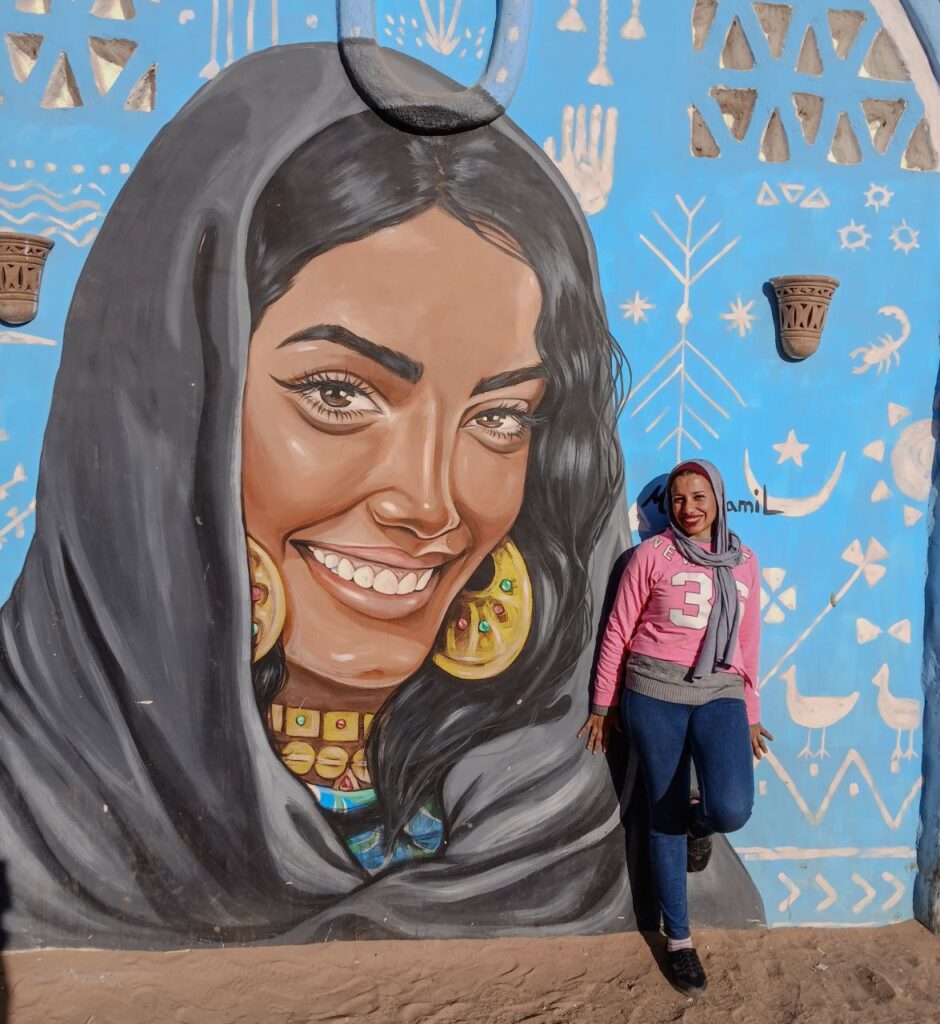Photograph of a mural of a smiling woman
