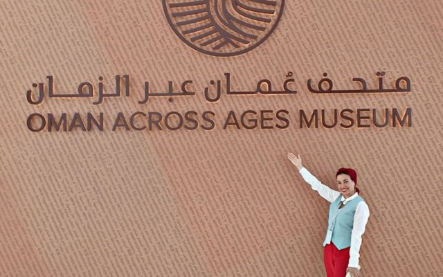 Woman standing outside Oman Across Ages Museum