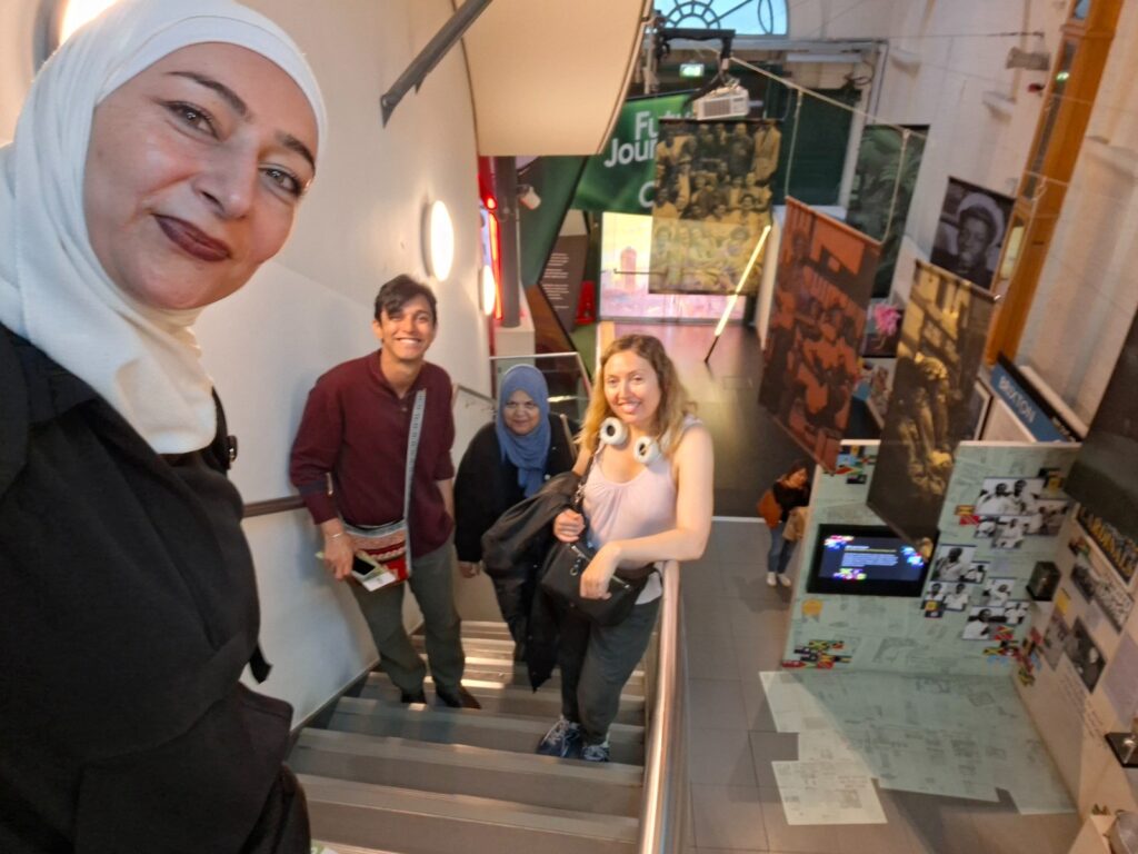4 people taking a selfie on a flight of stairs