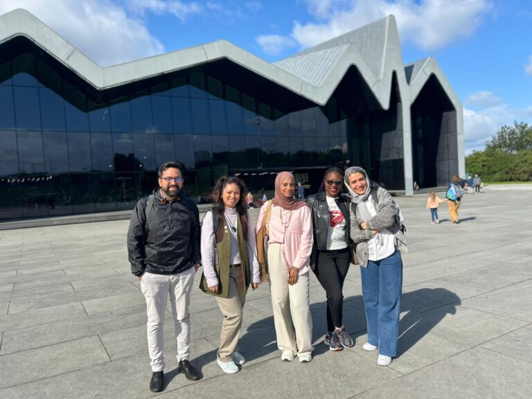 ITP fellows standing outside the Riverside Museum, Glasgow