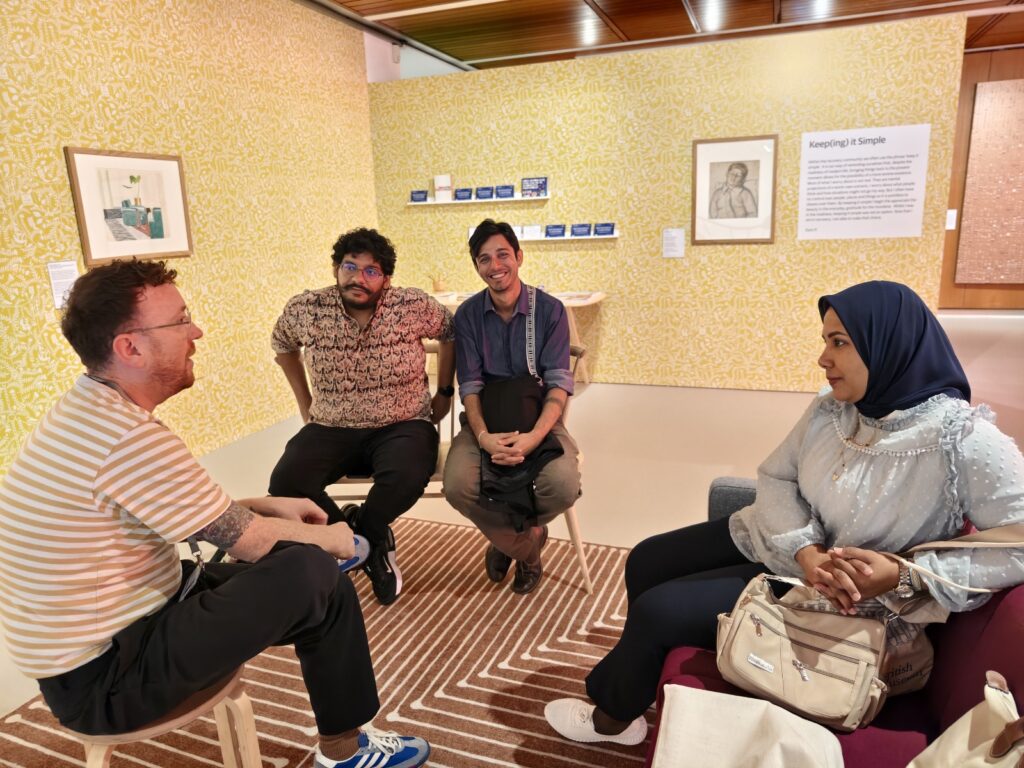 Four people sat on chairs
