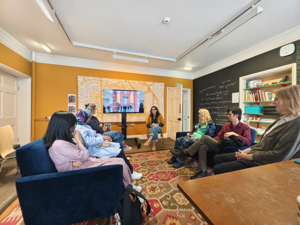 A group of people sat on sofas