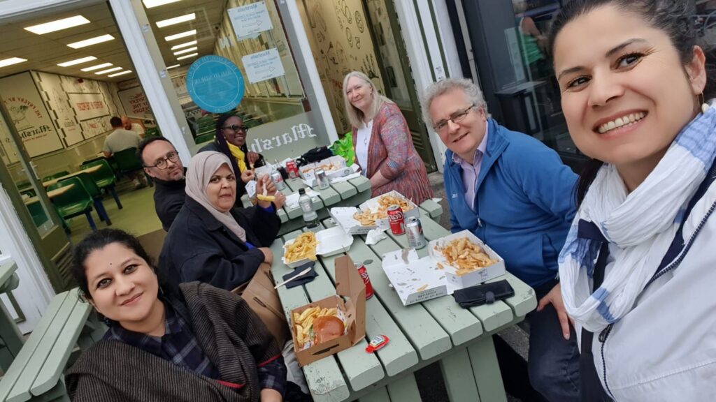 ITP fellows eating fish and chips