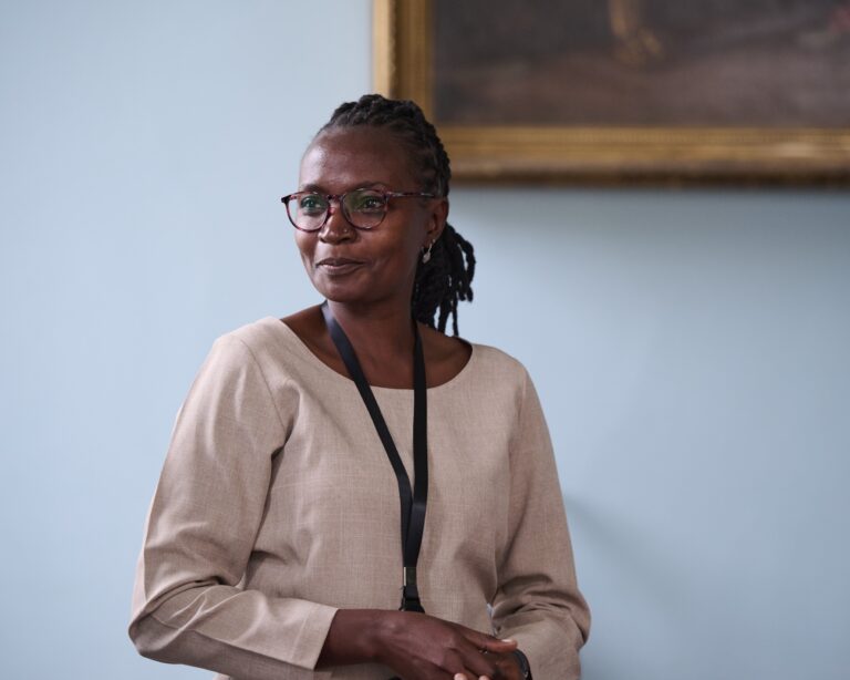 Photograph of a woman giving a presentation