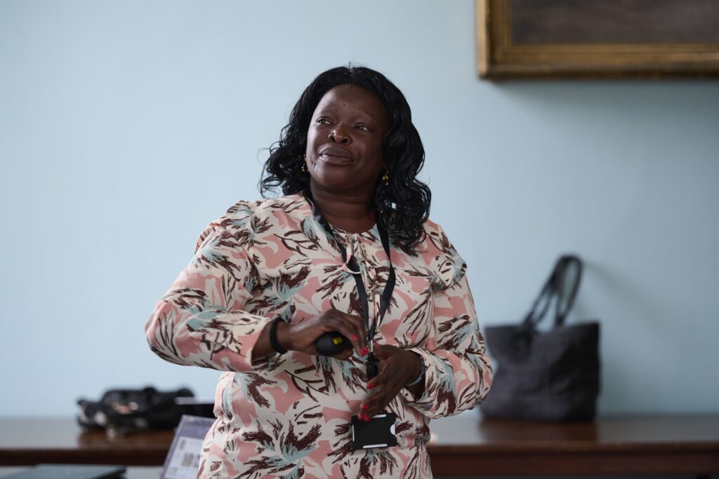 Photograph of a woman giving a presentation