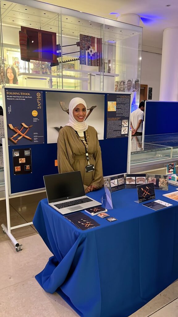 Gehad Ali (Egypt) standing with her object in focus display