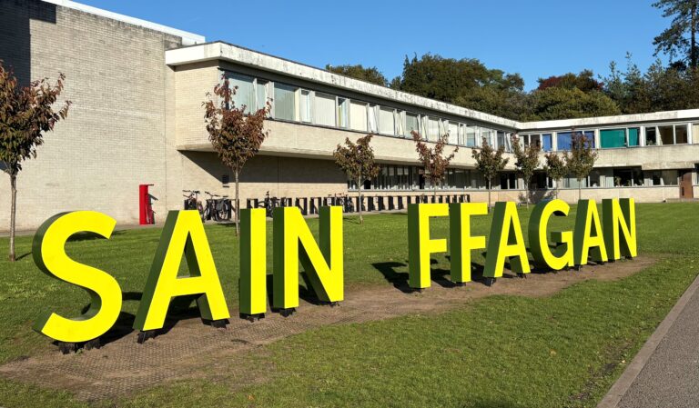Big sign at the entrance of Saint Fagans - reading Sain Ffagan.